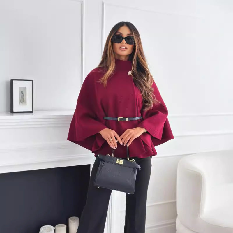 Sophisticated wine red woolen cloak with batwing sleeves, a stand collar, and an adjustable belt for a bold statement look.