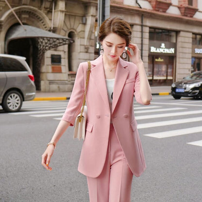 Women's mid-length three-quarter sleeve blazer suit in pink from Eternal Gleams. Elegant and stylish workwear, available in sizes S to 4XL, perfect for professional and casual settings. Comfortable polyester and spandex blend fabric.