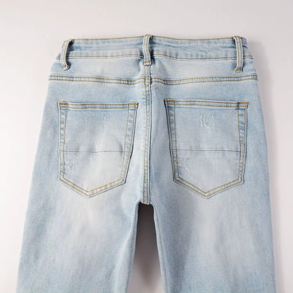 Patch de diamant chaud de couleur claire avec des trous dans des jeans serrés élastiques pour hommes